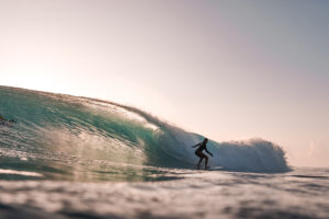 Back side surfer surfing HT's on a glassy morning