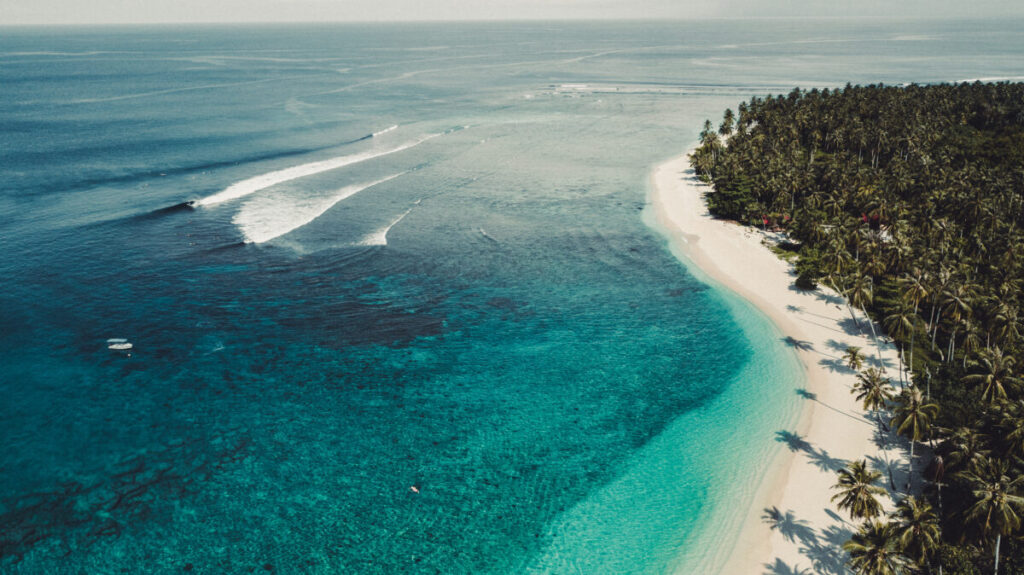 South Sipora island with a blue lagoon and white sandy beach